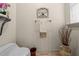 Stylish powder room with toilet, decor, neutral paint, and a unique decorative vase at 1654 Marina Lake Dr, Kissimmee, FL 34744