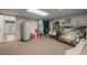 Spacious storage room with utilities, shelving, and a glimpse into an adjacent room at 1654 Marina Lake Dr, Kissimmee, FL 34744