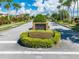 A brick entrance to a subdivision, with manicured landscaping and decorative shrubbery at 1654 Marina Lake Dr, Kissimmee, FL 34744