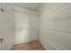 Efficient walk-in closet with wood floors, and multiple levels of wire shelving to maximize storage at 1654 Marina Lake Dr, Kissimmee, FL 34744