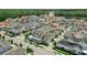 Community aerial view showcasing diverse home styles and proximity to lush greenery at 1850 Treasure Cv, Celebration, FL 34747