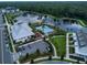 Aerial view of a community featuring a pool, clubhouse, parking, green spaces, and waterfront access at 1850 Treasure Cv, Celebration, FL 34747
