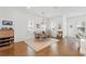 Bright dining area with hardwood floors, a modern chandelier, and a large window provides ample natural light at 1850 Treasure Cv, Celebration, FL 34747