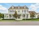 Charming two-story home with a welcoming front porch and beautifully landscaped front yard at 1850 Treasure Cv, Celebration, FL 34747