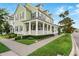 Charming home with a spacious front porch and well-manicured lawn at 1850 Treasure Cv, Celebration, FL 34747