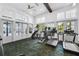 Bright gym with high ceilings, treadmills, ellipticals, and a stair climber for diverse fitness routines at 1850 Treasure Cv, Celebration, FL 34747