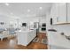 Bright kitchen with hardwood floors, a center island, and open layout offers an ideal gathering space at 1850 Treasure Cv, Celebration, FL 34747