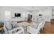 Bright and open living area with a kitchen island, stainless steel appliances, and a comfortable sitting area at 1850 Treasure Cv, Celebration, FL 34747