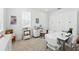 Bright home office with built-in storage, a large desk, and carpeted flooring for added comfort at 1850 Treasure Cv, Celebration, FL 34747