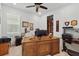 Cozy office space featuring wood desk, built in storage, and neutral walls at 1850 Treasure Cv, Celebration, FL 34747