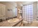 Bathroom with shower and tub combination, and neutral countertops at 214 Tupelo Cir, Davenport, FL 33897