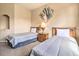Comfortable bedroom featuring two beds, stylish decor, and ample space for relaxation at 214 Tupelo Cir, Davenport, FL 33897