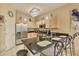 Well-equipped kitchen with stainless steel appliances, granite countertops, and a breakfast bar at 214 Tupelo Cir, Davenport, FL 33897