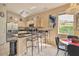 Modern kitchen with stainless steel appliances, granite counters, and a cozy breakfast nook at 214 Tupelo Cir, Davenport, FL 33897