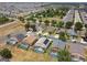 Aerial view of neighborhood homes, many featuring solar panels and screened-in pools at 223 Cadiz Loop, Davenport, FL 33837