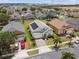 Aerial view of a neighborhood featuring sidewalks, driveways, and maintained lawns at 223 Cadiz Loop, Davenport, FL 33837