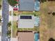 Overhead shot showing neighboring houses and backyards with private screened-in pools at 223 Cadiz Loop, Davenport, FL 33837