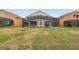 Large backyard featuring a screened-in pool and plenty of green space at 223 Cadiz Loop, Davenport, FL 33837
