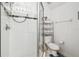 Bright bathroom featuring a shower and toilet combo, with a glass door at 223 Cadiz Loop, Davenport, FL 33837