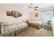 Bedroom with two beds, a ceiling fan, and a window with wooden blinds at 223 Cadiz Loop, Davenport, FL 33837