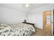 Bedroom with a bed with patterned bedding and a closed closet at 223 Cadiz Loop, Davenport, FL 33837