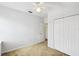 Neutral bedroom features a closet and a doorway to another room at 223 Cadiz Loop, Davenport, FL 33837