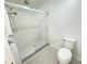 Bathroom with white tile shower and sliding glass doors at 2330 Prime Cir # A, Kissimmee, FL 34746