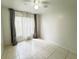 A bright bedroom featuring large windows that fill the space with natural light at 2330 Prime Cir # A, Kissimmee, FL 34746