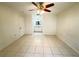 Bedroom with ensuite bath featuring tile flooring and natural lighting at 2330 Prime Cir # A, Kissimmee, FL 34746