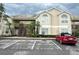 Attractive condo complex exterior with parking and well-kept landscaping at 2330 Prime Cir # A, Kissimmee, FL 34746