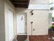 Inviting front entrance with a secured door and well-maintained exterior at 2330 Prime Cir # A, Kissimmee, FL 34746