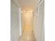 Hallway lined with white closets and tiled floors at 2330 Prime Cir # A, Kissimmee, FL 34746