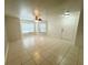 Spacious living room featuring tile flooring, ceiling fan, and lots of natural light at 2330 Prime Cir # A, Kissimmee, FL 34746