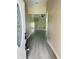 Inviting entryway with an oval glass insert door and modern gray flooring at 2385 Andrews Valley Dr, Kissimmee, FL 34758