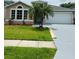 Charming single-Gathering home with well-manicured lawn and two-car garage at 2385 Andrews Valley Dr, Kissimmee, FL 34758