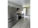 Modern kitchen featuring stainless steel appliances, granite countertops, and shaker-style cabinets at 2385 Andrews Valley Dr, Kissimmee, FL 34758