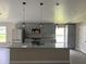Spacious kitchen with a large island, stainless steel appliances, and modern pendant lighting at 2385 Andrews Valley Dr, Kissimmee, FL 34758