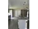 Open kitchen layout showcasing a large island with pendant lighting and granite countertops at 2385 Andrews Valley Dr, Kissimmee, FL 34758