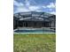 Beautiful screened-in pool and patio area for relaxing by the water at 2385 Andrews Valley Dr, Kissimmee, FL 34758