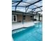 Sparkling pool with screened enclosure and outdoor patio space at 2385 Andrews Valley Dr, Kissimmee, FL 34758