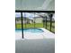 Beautiful screened pool area surrounded by lush landscaping and serene views at 2385 Andrews Valley Dr, Kissimmee, FL 34758