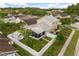 Home featuring a screened patio, fenced yard, and a storage shed, perfect for outdoor enjoyment at 2411 Parsons Pond Cir, Kissimmee, FL 34743