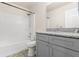 Bathroom featuring grey vanity with granite countertop at 2411 Parsons Pond Cir, Kissimmee, FL 34743