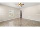 Bedroom with a ceiling fan and good natural light at 2411 Parsons Pond Cir, Kissimmee, FL 34743