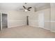 This bedroom has a ceiling fan and an ensuite bathroom at 2411 Parsons Pond Cir, Kissimmee, FL 34743