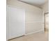 This bedroom features a closet and tile flooring at 2411 Parsons Pond Cir, Kissimmee, FL 34743