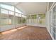 Enclosed lanai with tile floors and lots of windows providing light and bright space at 2411 Parsons Pond Cir, Kissimmee, FL 34743