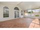 The enclosed lanai with tile flooring and french doors, offers a relaxing and bright living space at 2411 Parsons Pond Cir, Kissimmee, FL 34743