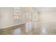 Bright living room featuring tile floors, ample natural light and a sliding door that allows access to the patio at 2411 Parsons Pond Cir, Kissimmee, FL 34743