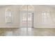 Living room with large windows, a sliding door to the patio and tile flooring offering a bright and airy space at 2411 Parsons Pond Cir, Kissimmee, FL 34743